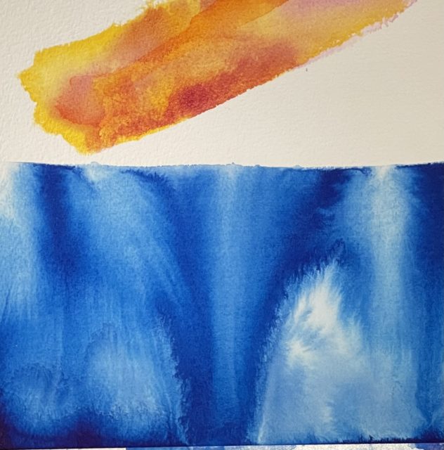 Horizontally divided abstract painting in 2 zones on paper. Above the horizon is white paper with diagonal yellow orange rectangular shape intruding. Below is stained din eep blue in shades from lighter to darker blue flowing color. It’s a flowing ‘wet-in-wet watercolor’ style. The media is not watercolor but rather it is done permanent archival inks. The colored inks separate much like watercolor. The large amount of pigment in the colored inks move beautifully in water before it dries. www.carolskinger.com 